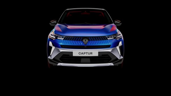 Prednji pogled na vozilo Captur full hybrid E-Tech s crnom pozadinom i osvijetljenom prednjom maskom