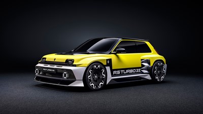 Renault 5 Turbo 3E, žuti električni sportski automobil bočno sprijeda.