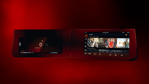Digitalni openR link sustav u vozilu s dva 10-inčna zaslona koji prikazuju navigaciju i izbornik za zabavu na crvenoj pozadini