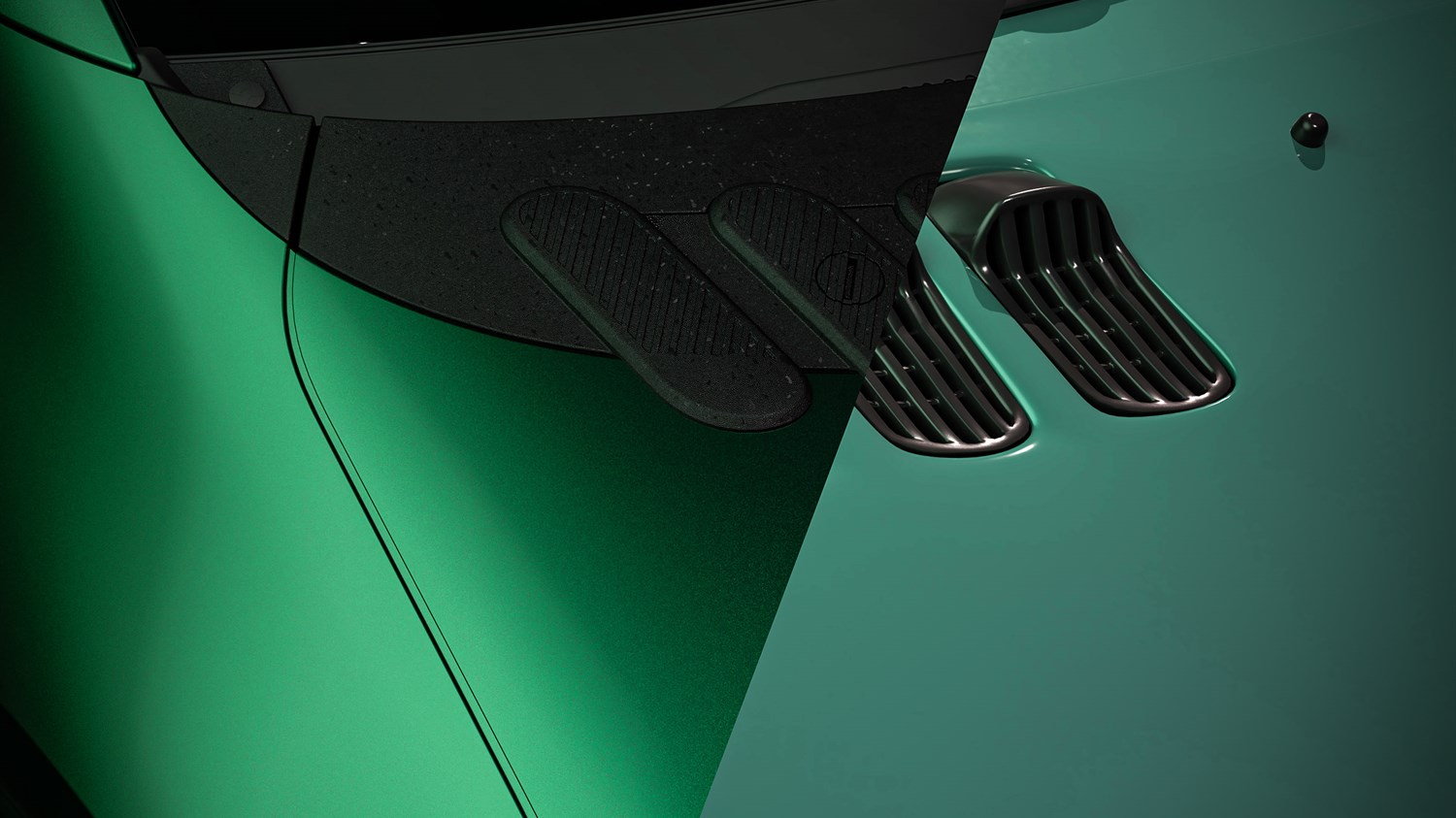 Detaljni prikaz haube novog vozila Renault Twingo u zelenoj boji s istaknutim ventilacijskim otvorima i modernim dizajnom.