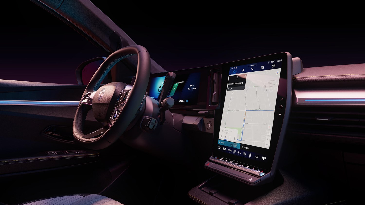 Unutrašnjost vozila Renault Scenic s upravljačem i velikim okomitim središnjim dodirnim zaslonom s prikazom navigacije.