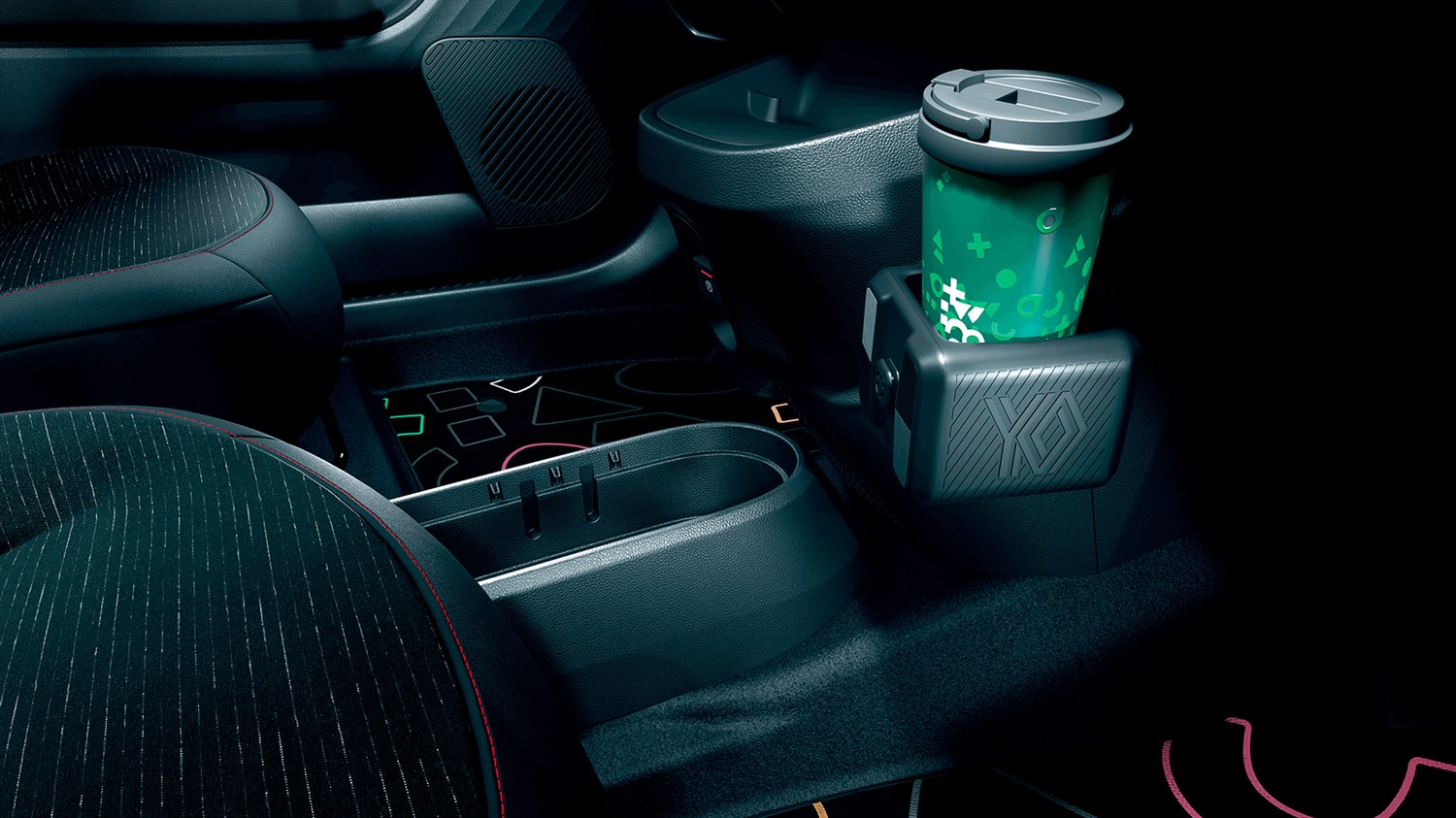 Detalj interijera u vozilu Renault Twingo E-Tech electric s držačem za čaše i modularnim YouClip dodatkom na središnjoj konzoli.