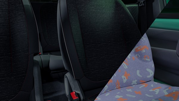 Detalj sjedala u vozilu Renault Twingo E-Tech electric s grafičkim presvlakama i crvenim prošivom