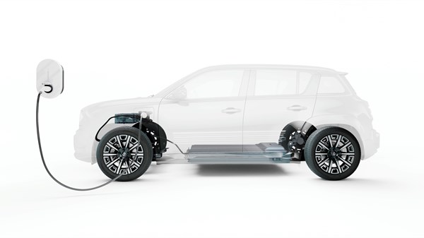 prozirna silueta vozila Renault 4 spojena na električni punjač, s vidljivim komponentama električne platforme

