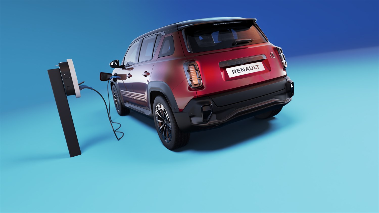 Renault 4 E-Tech electric vozilo spojeno na punionicu, prikaz straga na plavoj pozadini