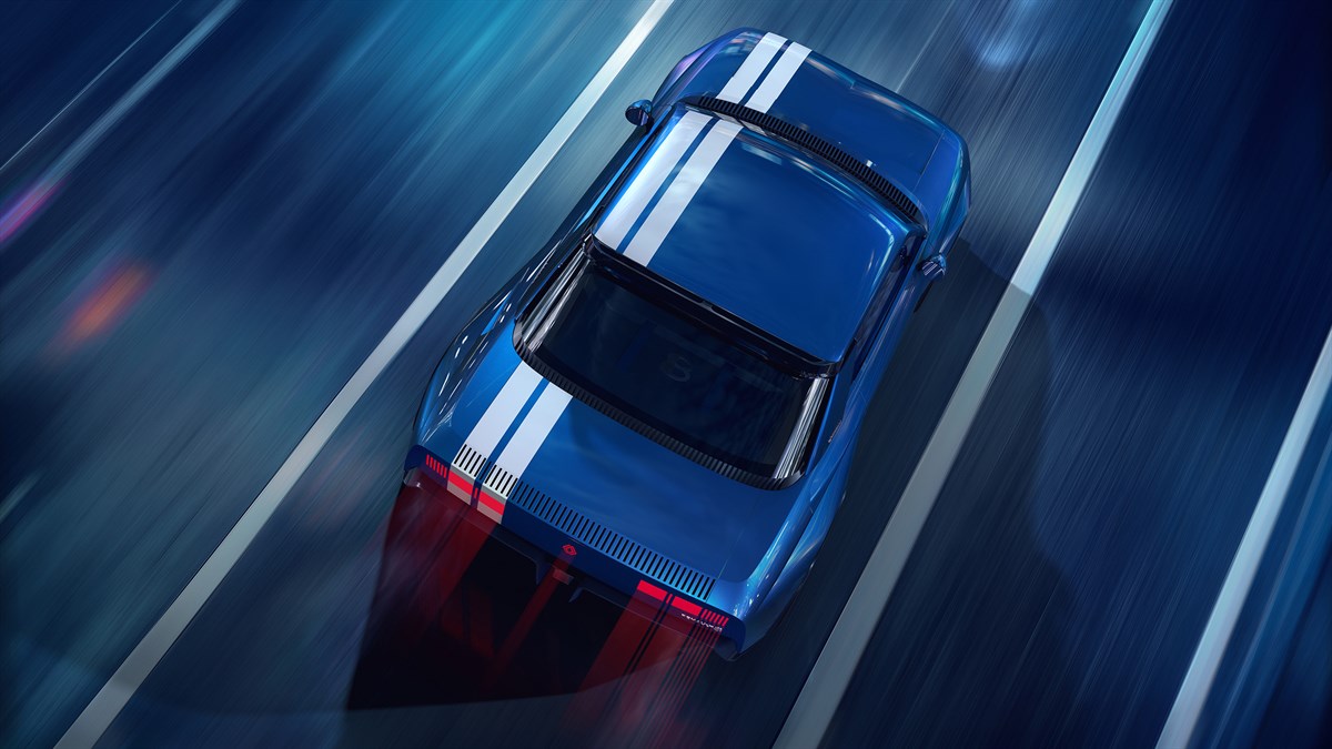 Pogled odozgo na Renault 8 Gordini Concept u vožnji s istaknutim dvostrukim bijelim prugama.